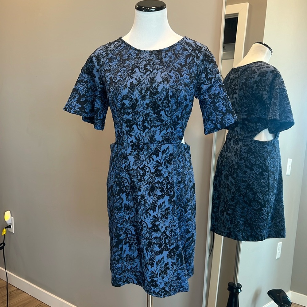 Mini dress with side cut outs.  Barely worn!